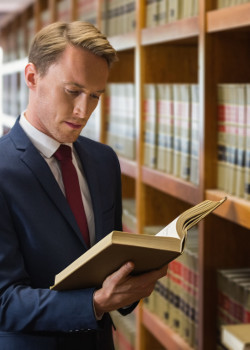 Handsome lawyer in the law library at the university